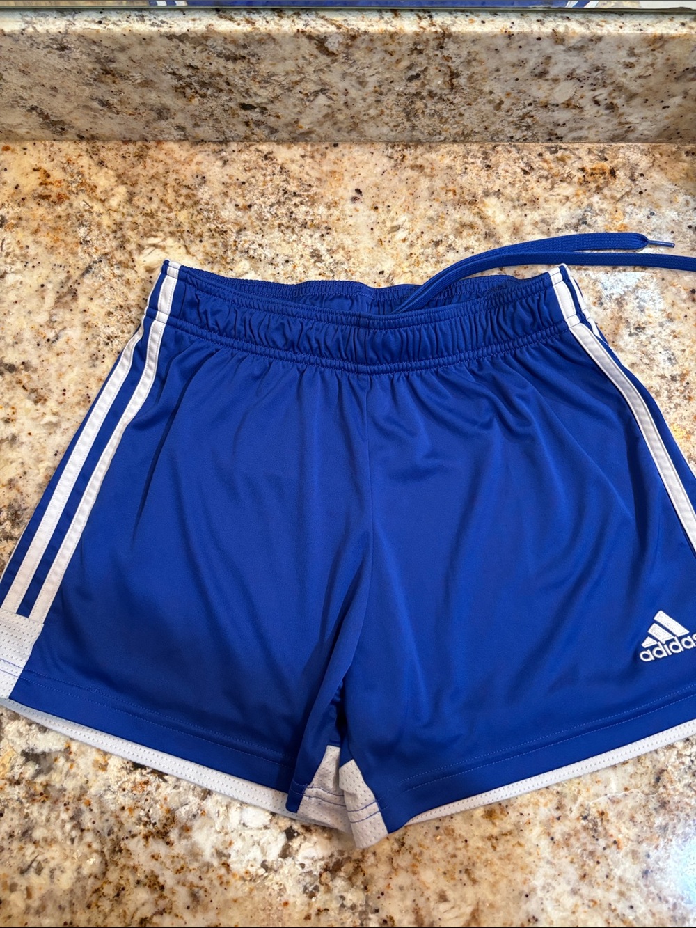 Women’s blue Adidas Tastigo 19 athletic shorts